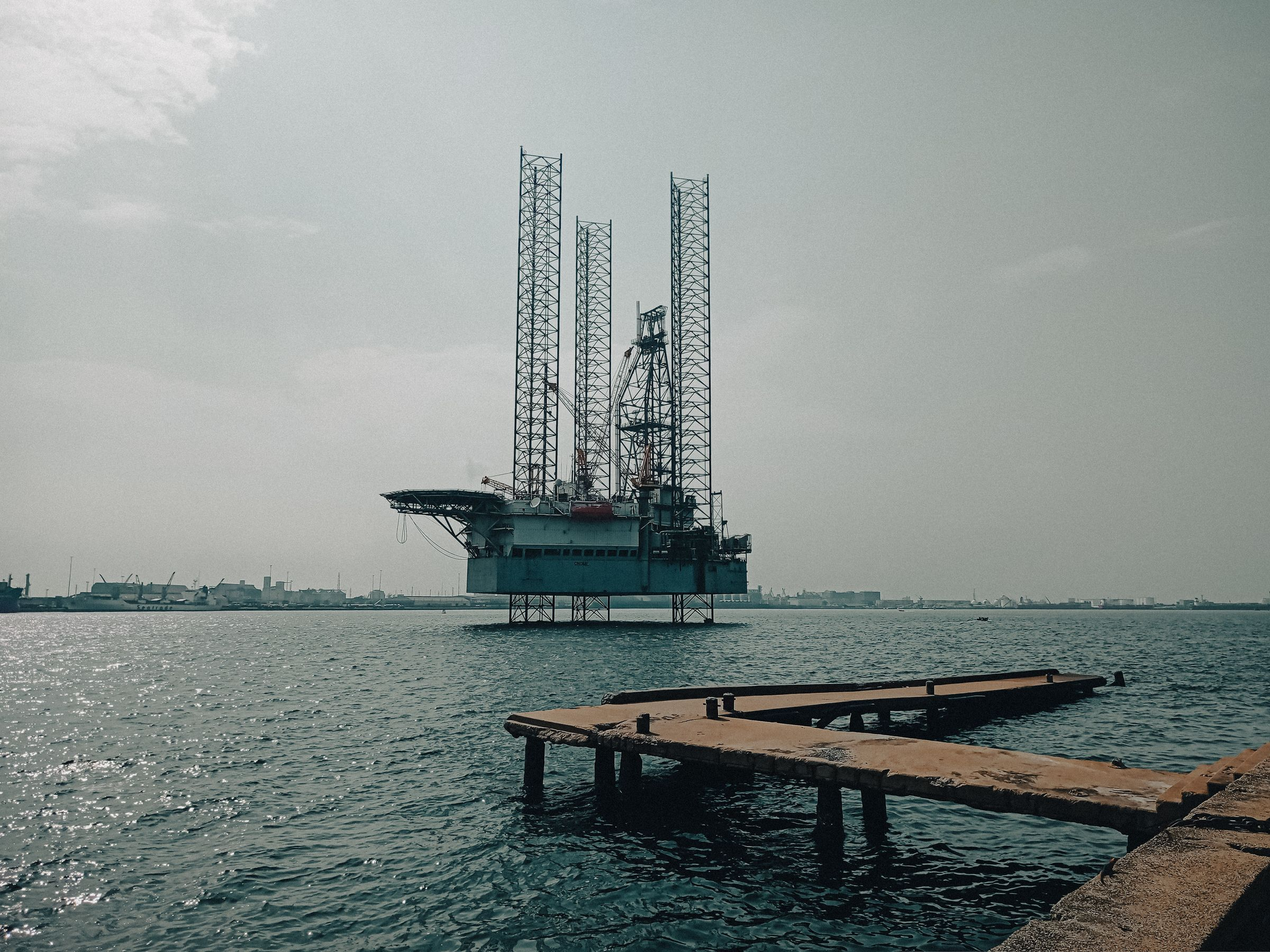 Rig by a jetty on calm water