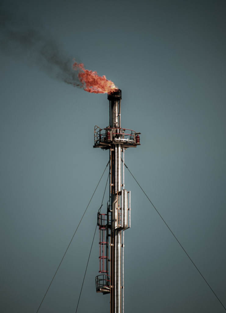 Gas flare stack against the sky