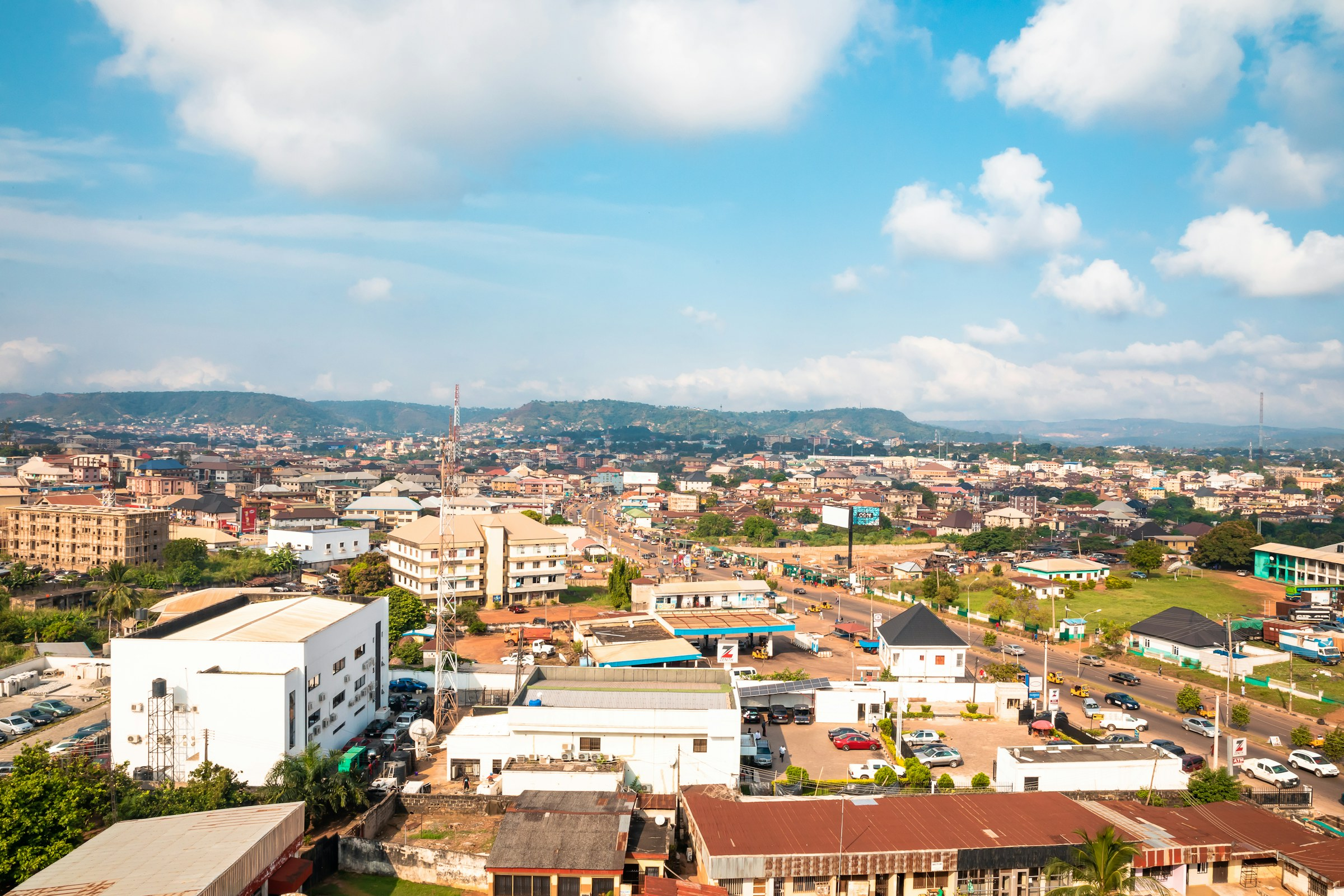 Aerial view of a green town and hills in Nigeria