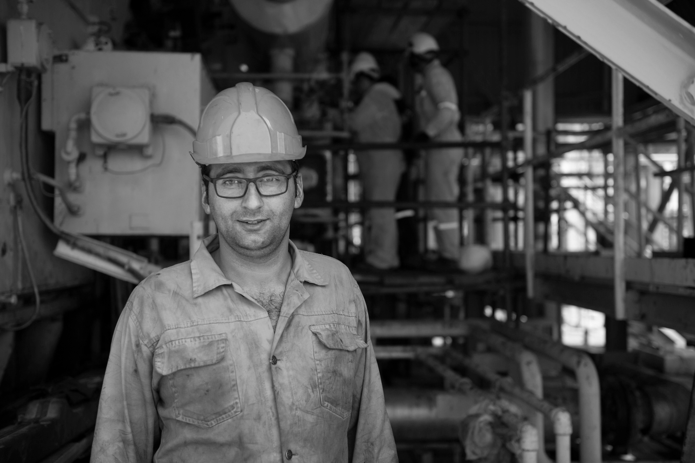 Engineer in a hard hat at a plant