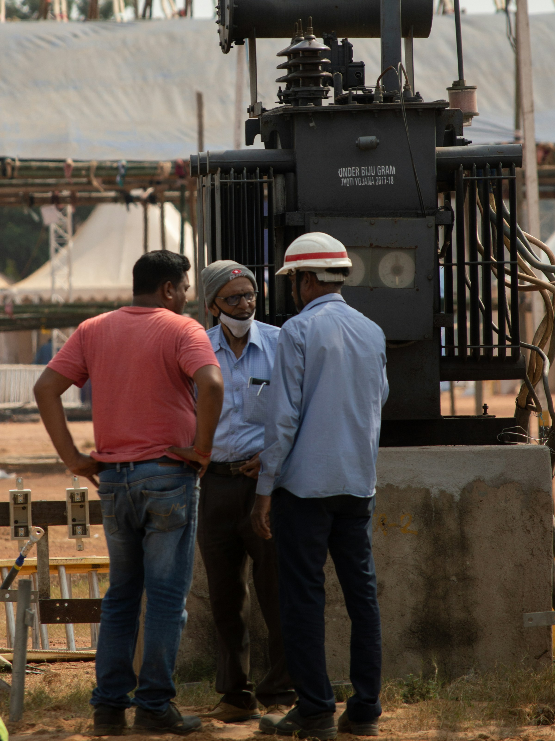 Engineers in discussion at an industrial site